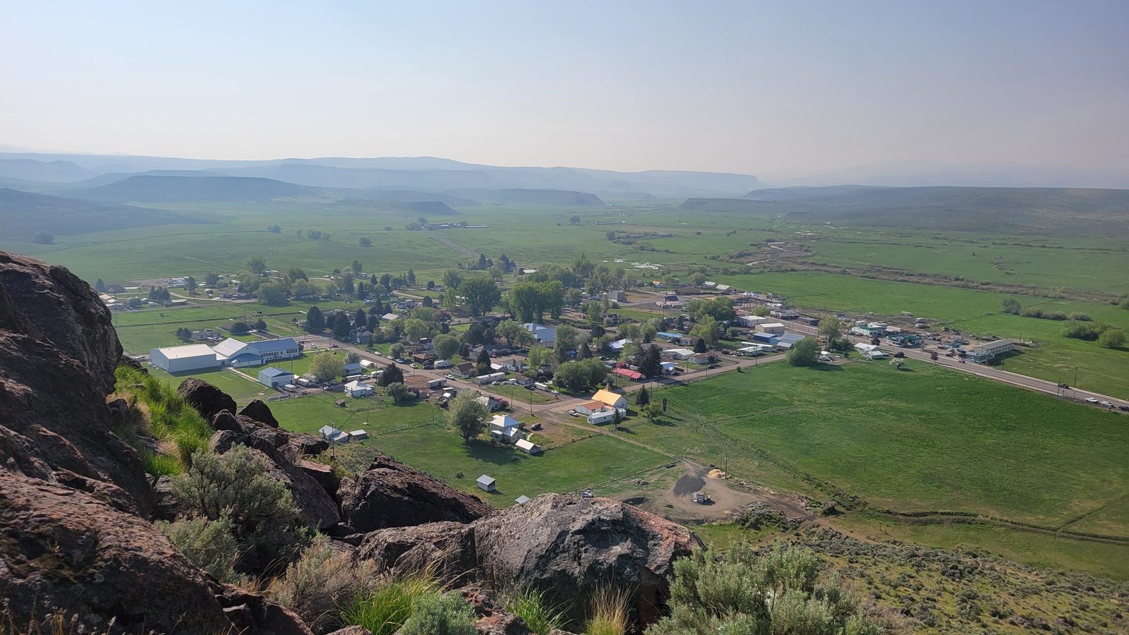 Jordan Valley, Oregon townsite from the rocky butte above town, green ranch country and the Owyhee uplands beyond