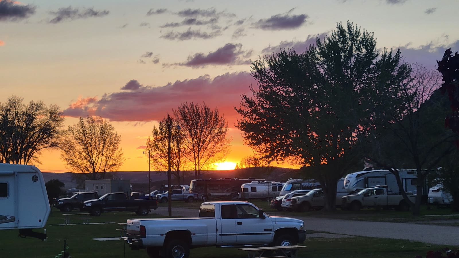 Sunset over RVs and cottonwoods at Sunny Ridge RV Park in Jordan Valley